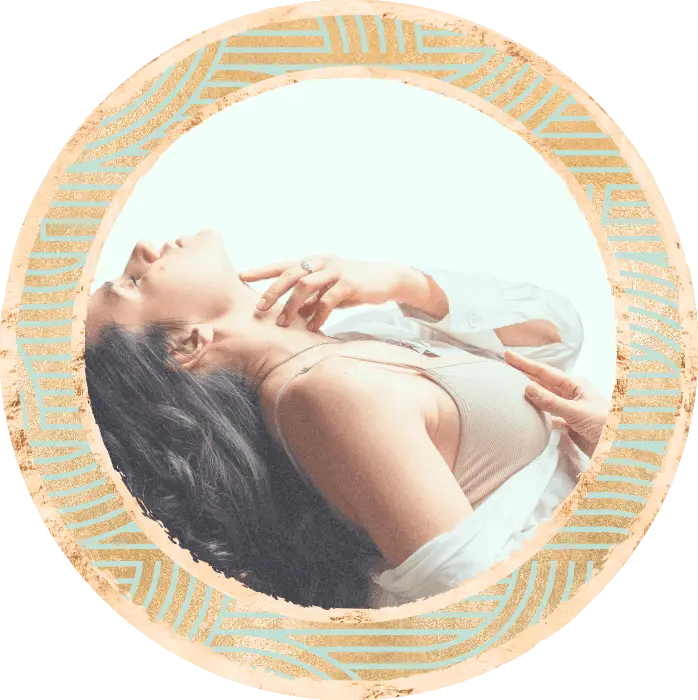 A lady doing a facilitated breathwork session