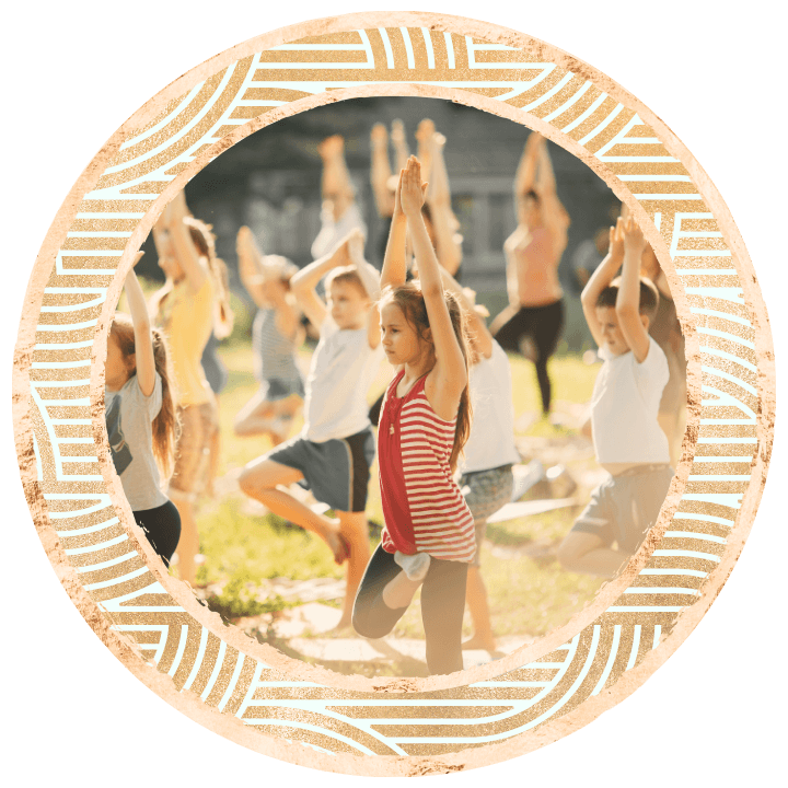 kids at a festival doing a yoga workshop